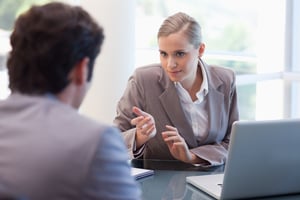 Professional businesswoman receiving a customer in her office