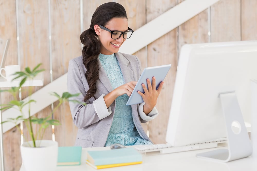 Stylish brunette working from home in her home office