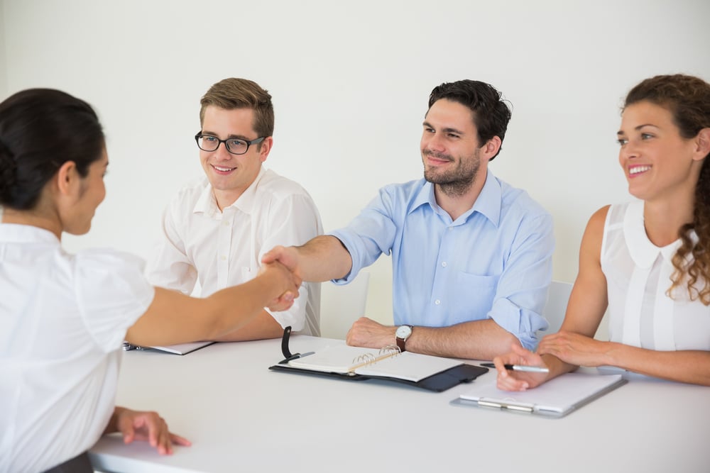 Business people shaking hands during job recruitment meeting in office-3
