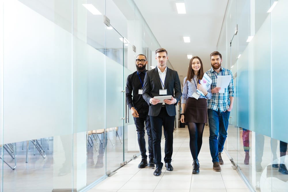 preventing_turnover_new_employees_walking_down_hallway