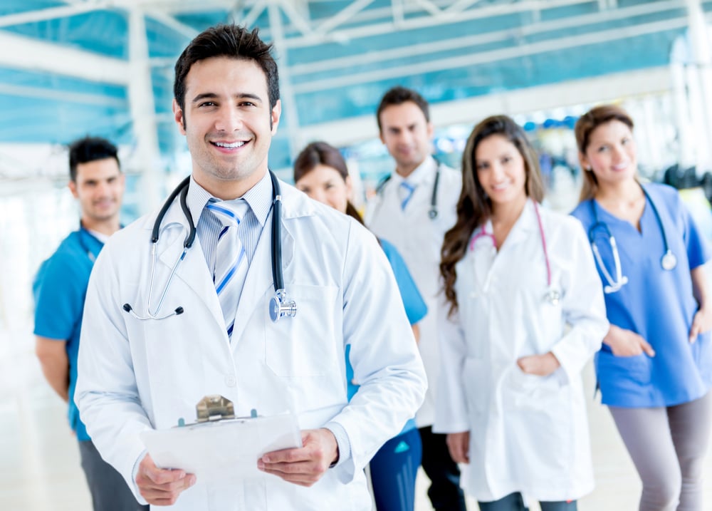 Male doctor with a medical group at the hospital