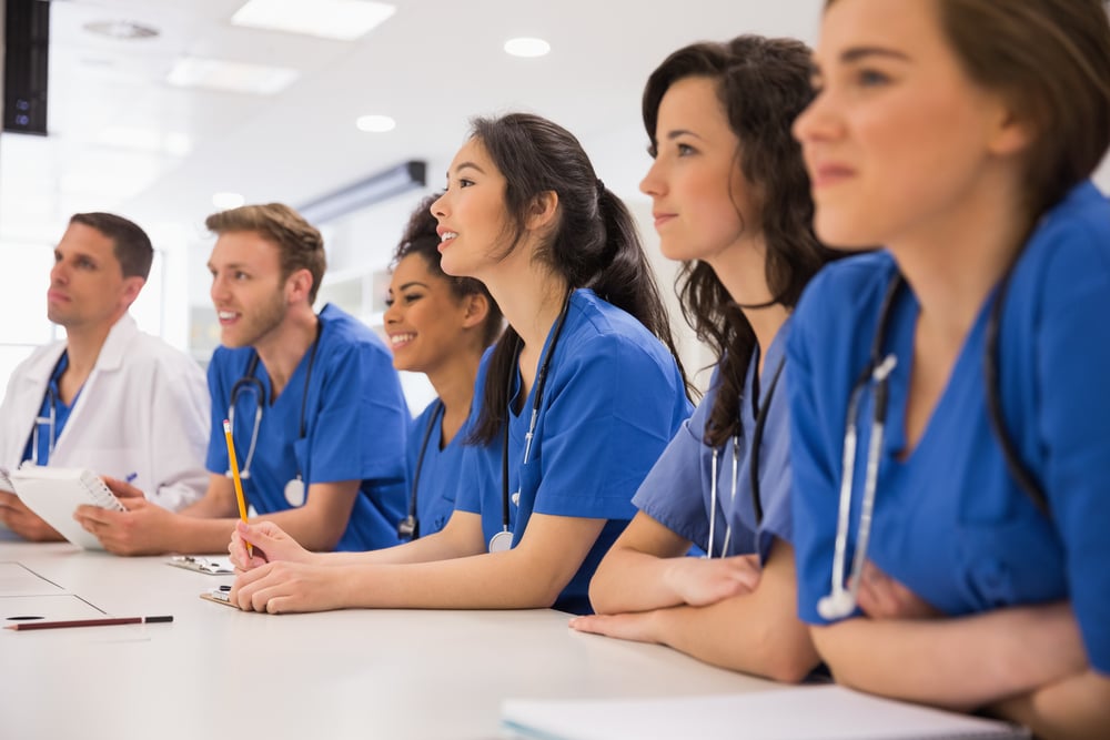 Medical students listening sitting at desk at the university-1